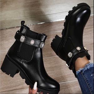 Black ankle boots with studs
